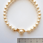 Bracelet perles imitation Majorque blanches 6 mm avec fermoir plaqué or